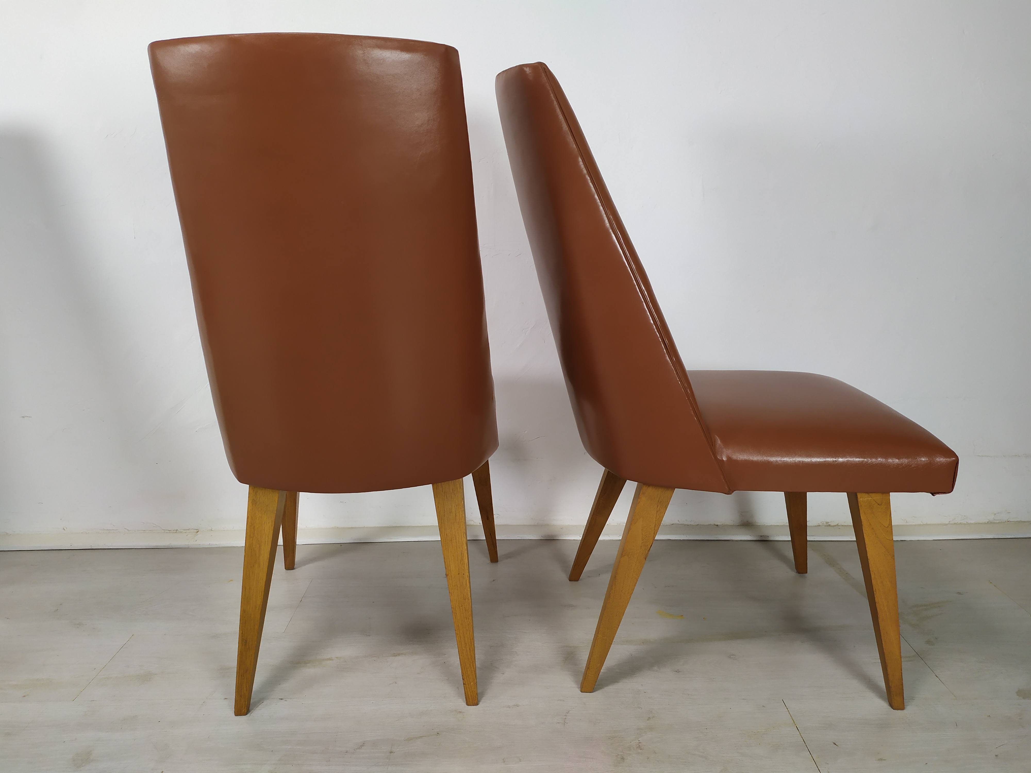 8 brown skai chairs 1950