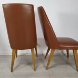 8 brown skai chairs 1950