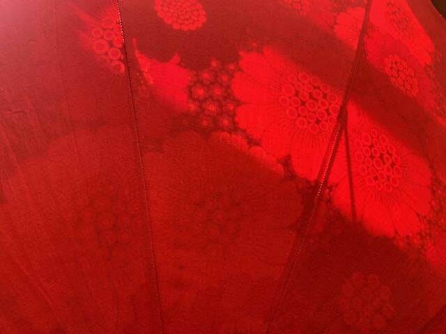 Large floral tilting beach umbrella with cotton fringes, 1960