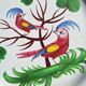 Earthenware plate with parrot decoration