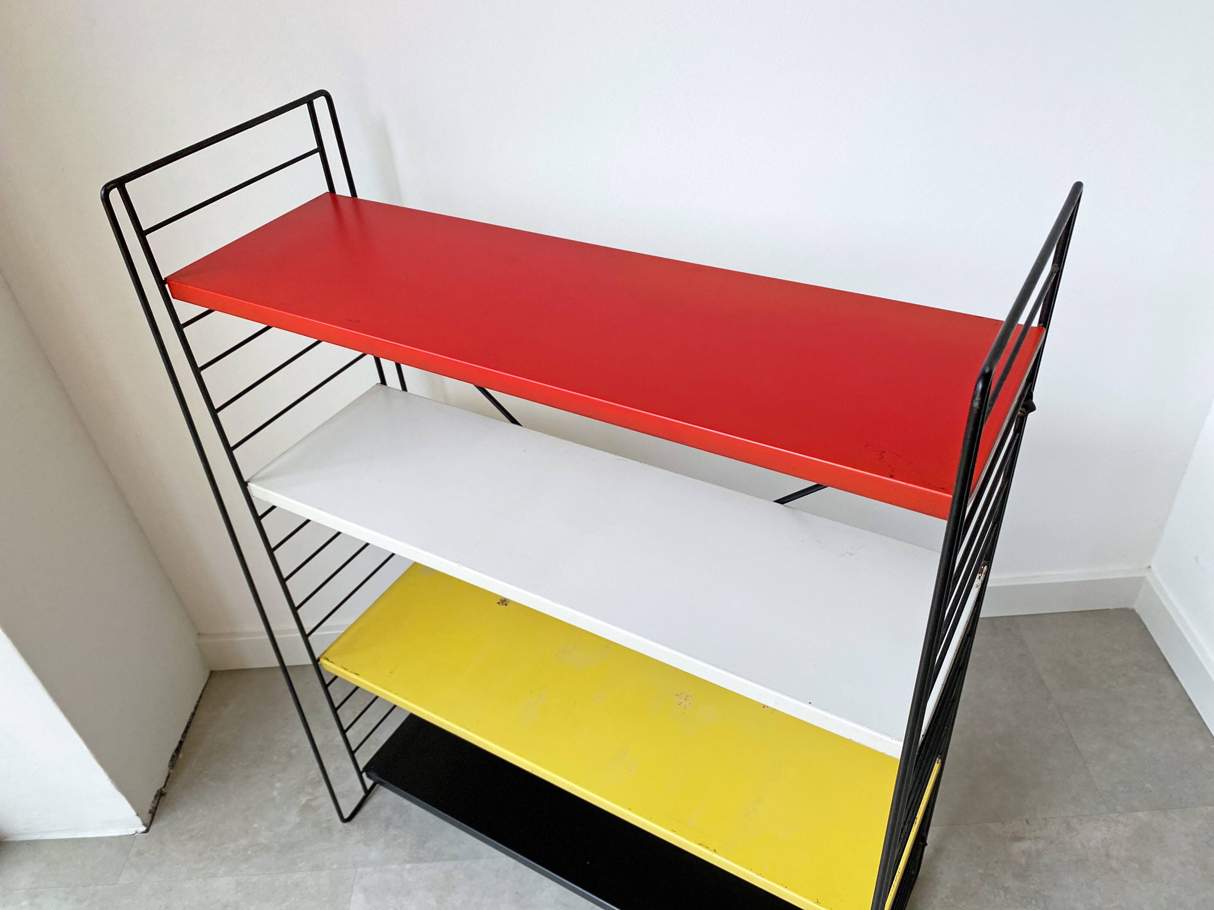 Mid century free standing tomado shelving system / bookcase designed by d. dekker
