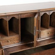 Antique English oak secretary from the 18th century with a stepped interior
