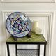 Polychrome decorative ceramic plate