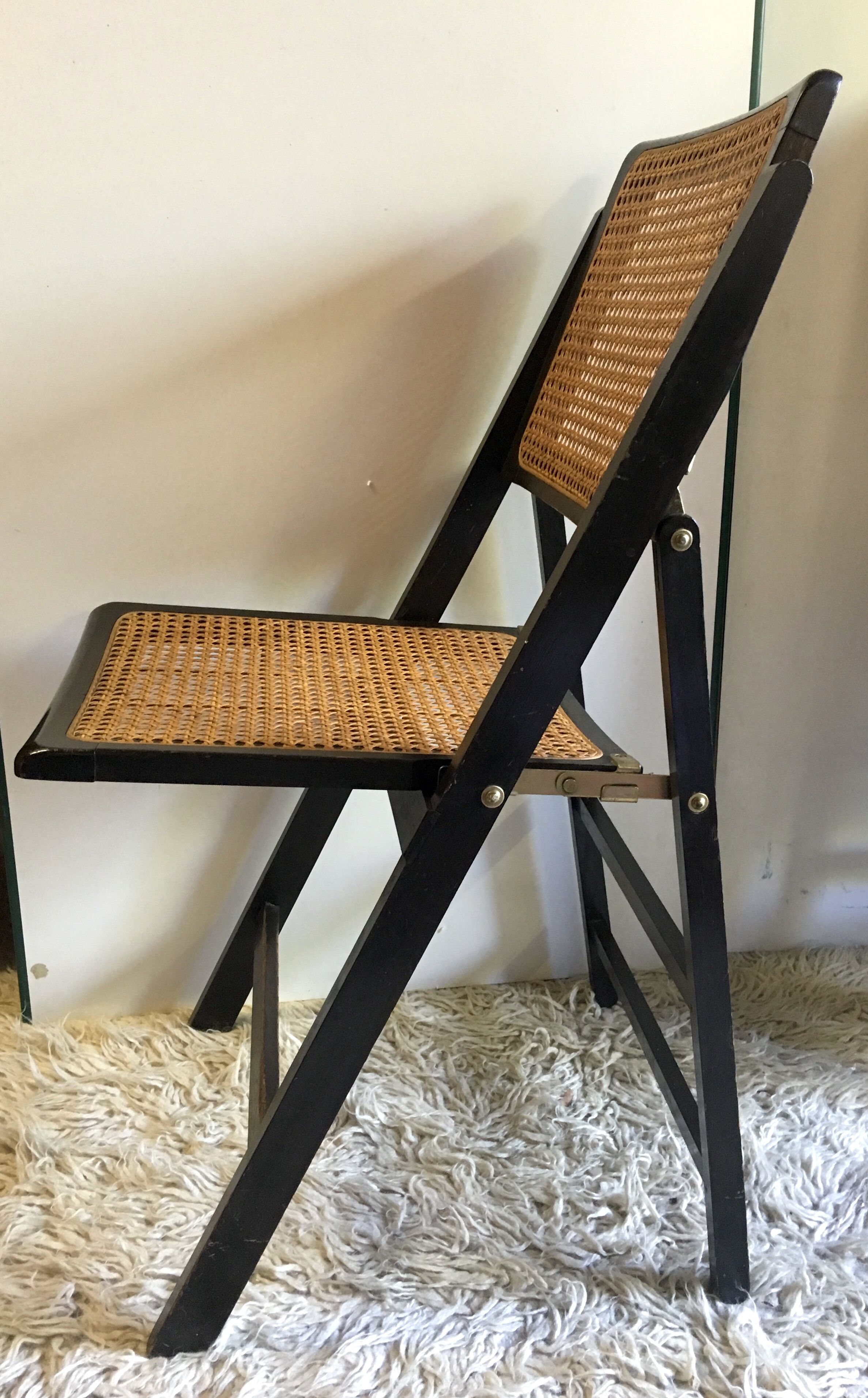 Four folding wooden and canning chairs - 70s