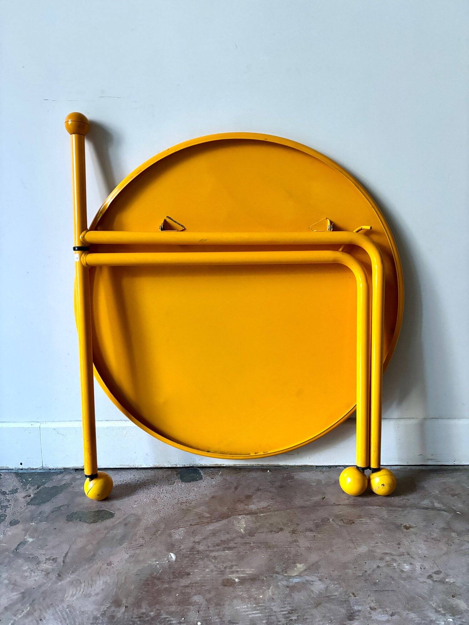 Yellow metal tripod coffee table by Tord Bjorklund for Ikea, circa 1980