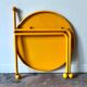 Yellow metal tripod coffee table by Tord Bjorklund for Ikea, circa 1980