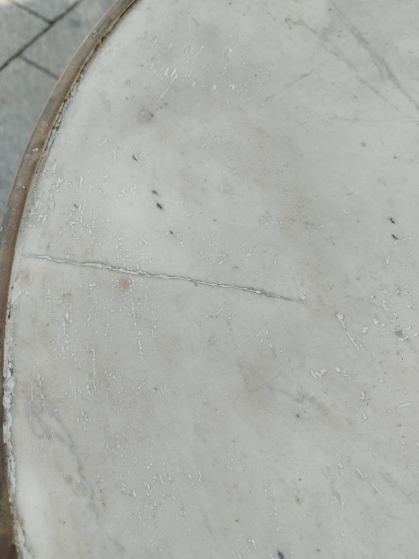 Old bistro table with marble top and cast iron base.