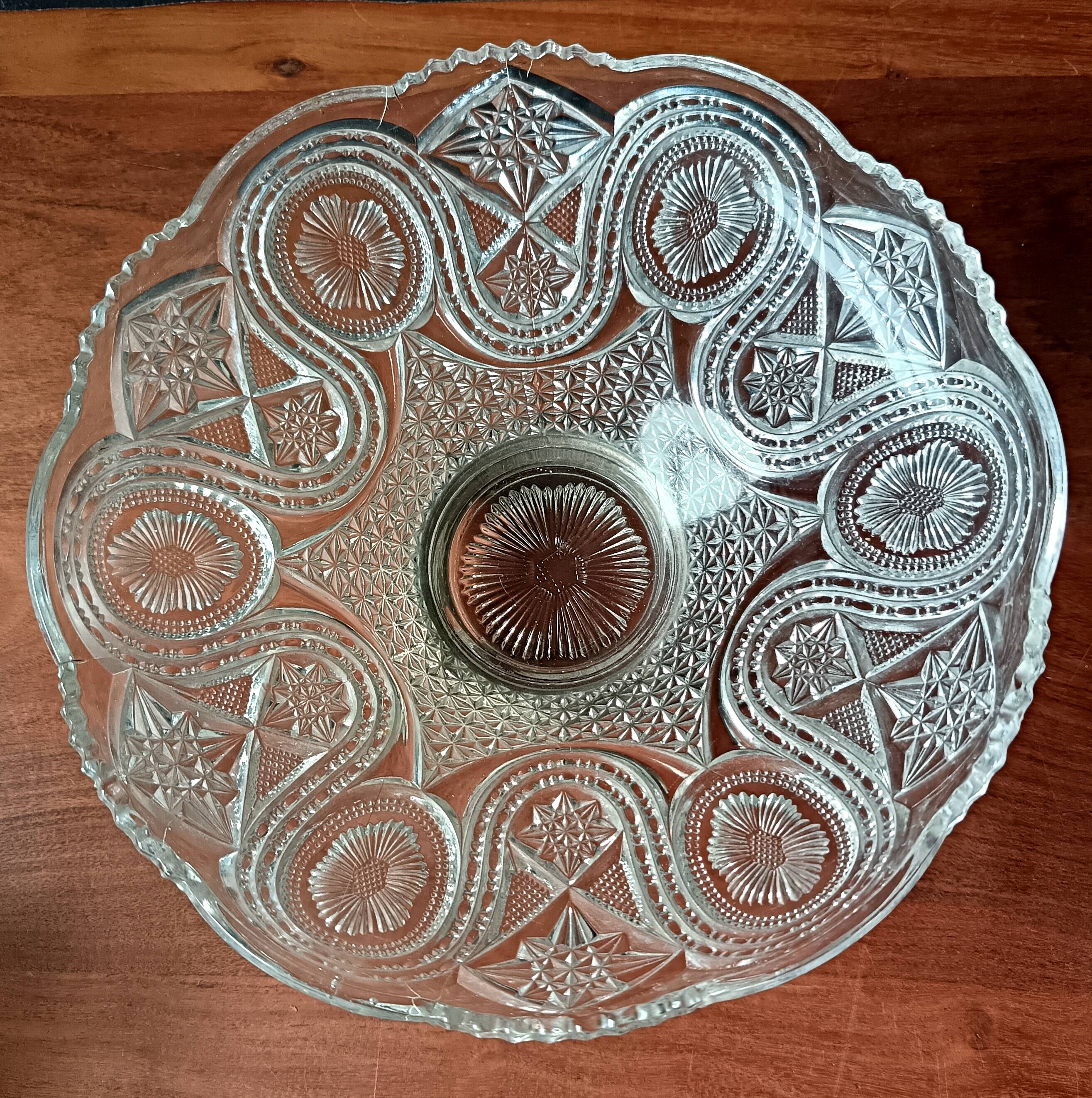 Transparent glass dish on vintage metal stand