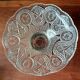 Transparent glass dish on vintage metal stand