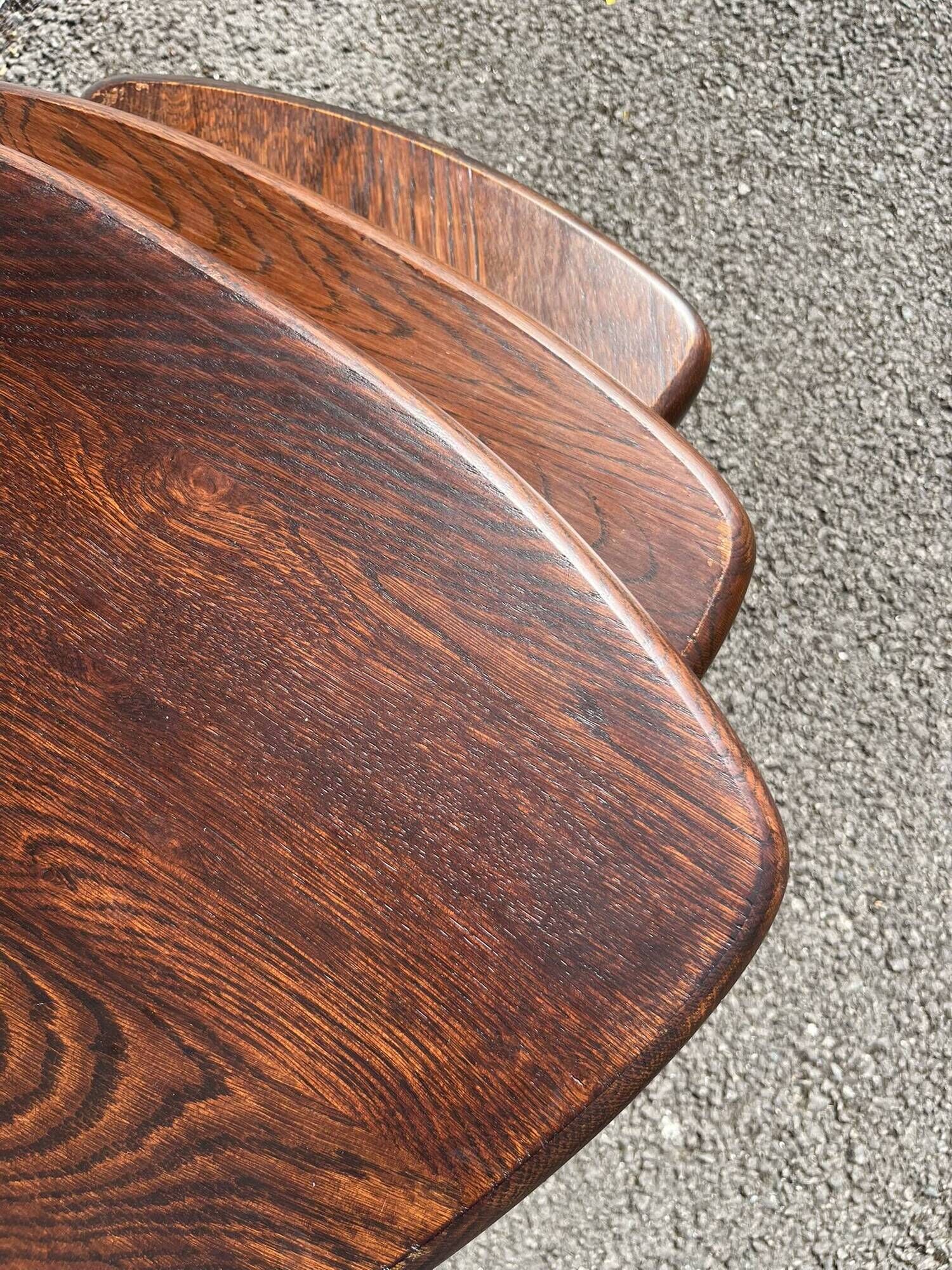 Nested tripod tables made of solid wood, in a modernist brutalist style.
