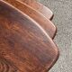 Nested tripod tables made of solid wood, in a modernist brutalist style.