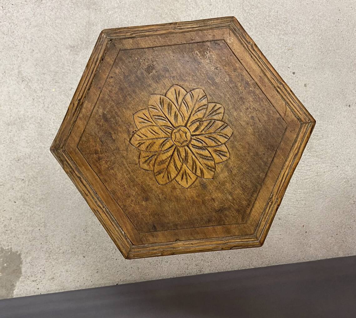 Carved wooden pedestal table