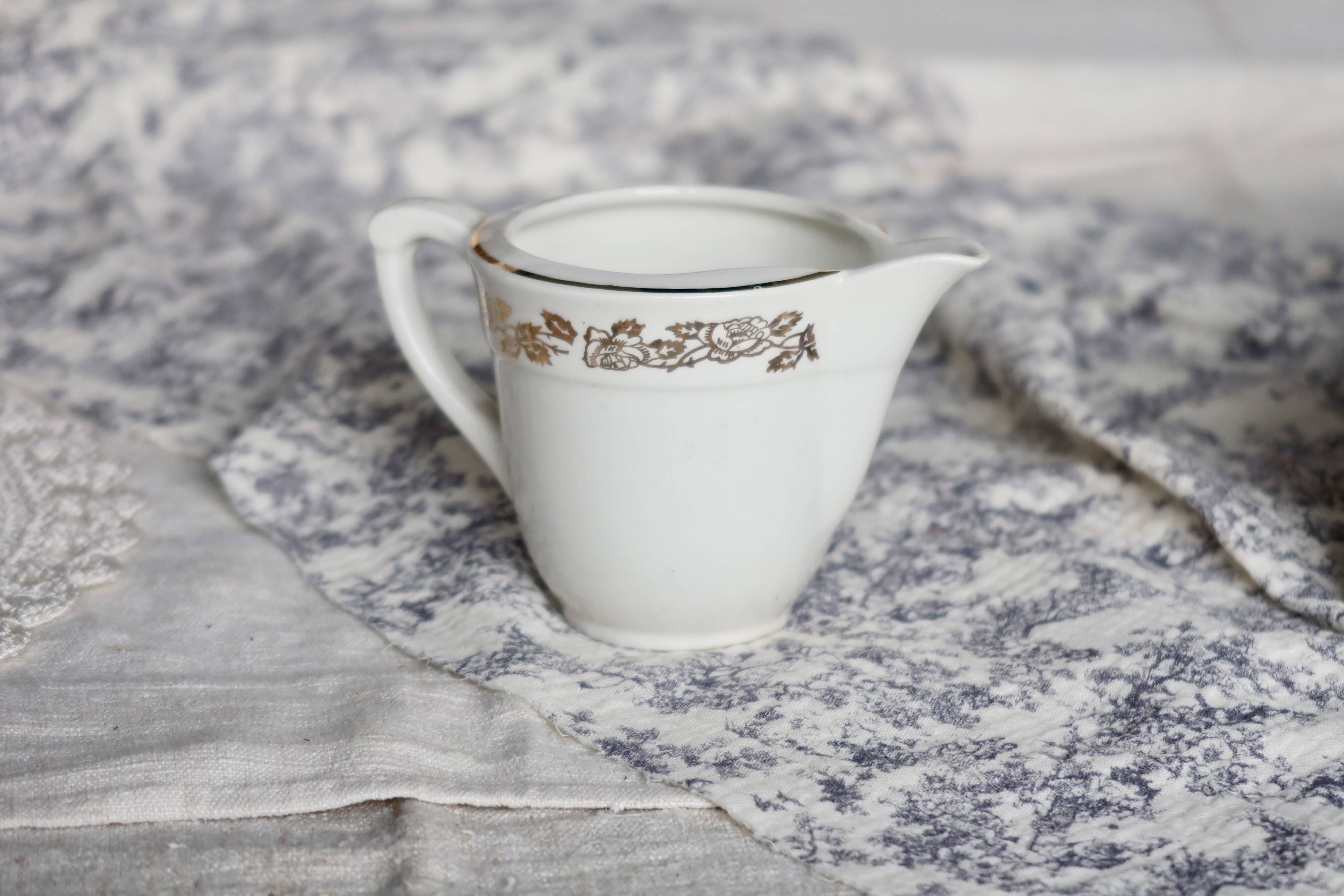 Vintage earthenware milk jug from Moulin des Loups – Gold floral motif