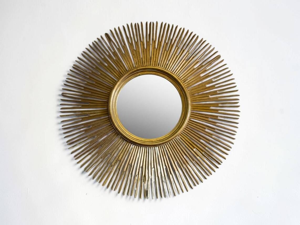Large sunburst mirror with beveled glass and gilded wood from around 2010.