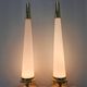Pair of Hollywood Regency table lamps in brass with glass shades.
