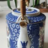 Japanese-inspired porcelain teapot.otifs Geishas kimonos, cherry blossoms