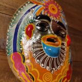 Mexican mask from the 1970s, hand-painted on terracotta.