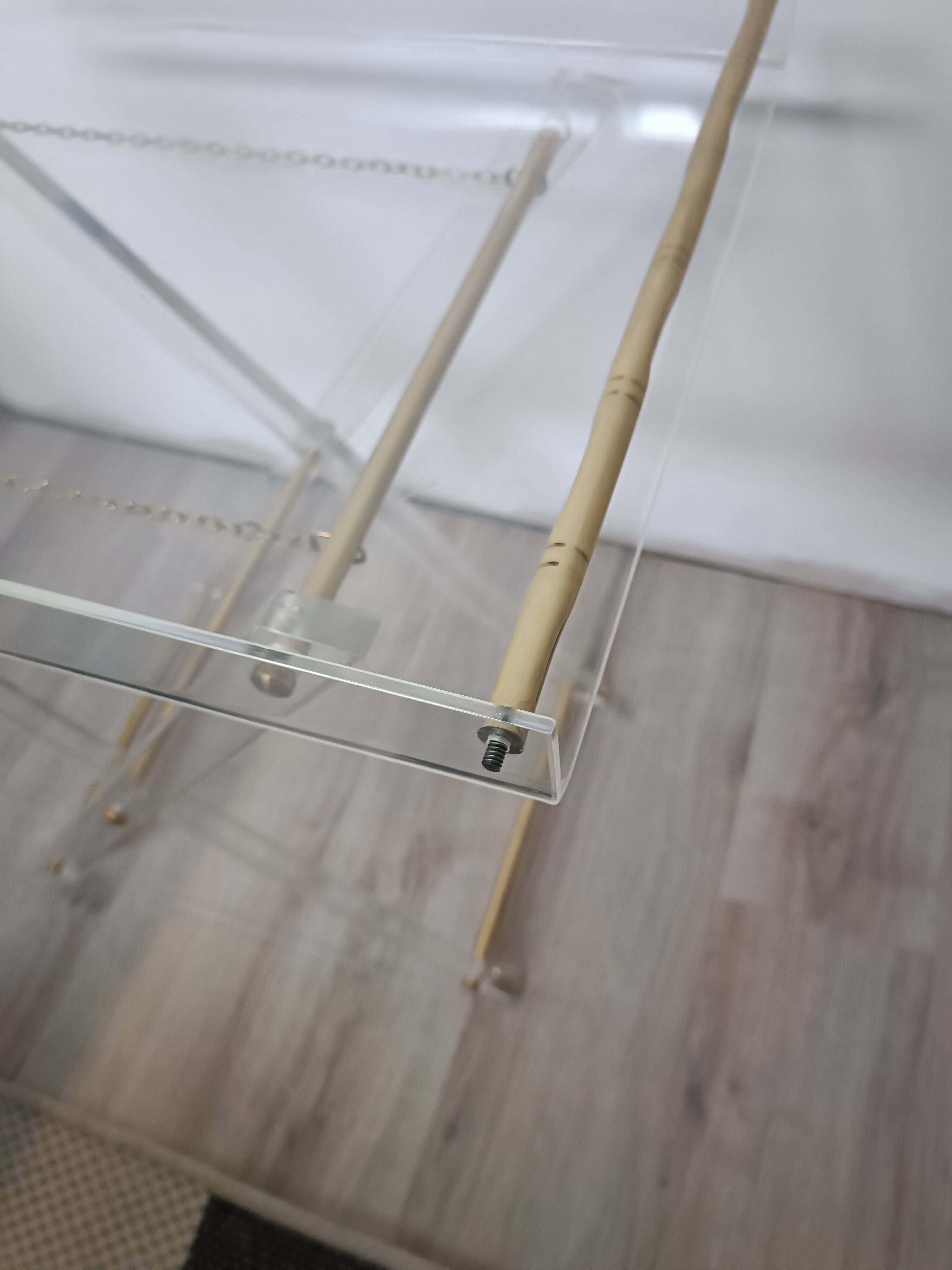 Folding side table in plexiglass and brass, 1970s.