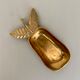 Empty vintage pear-shaped brass pocket