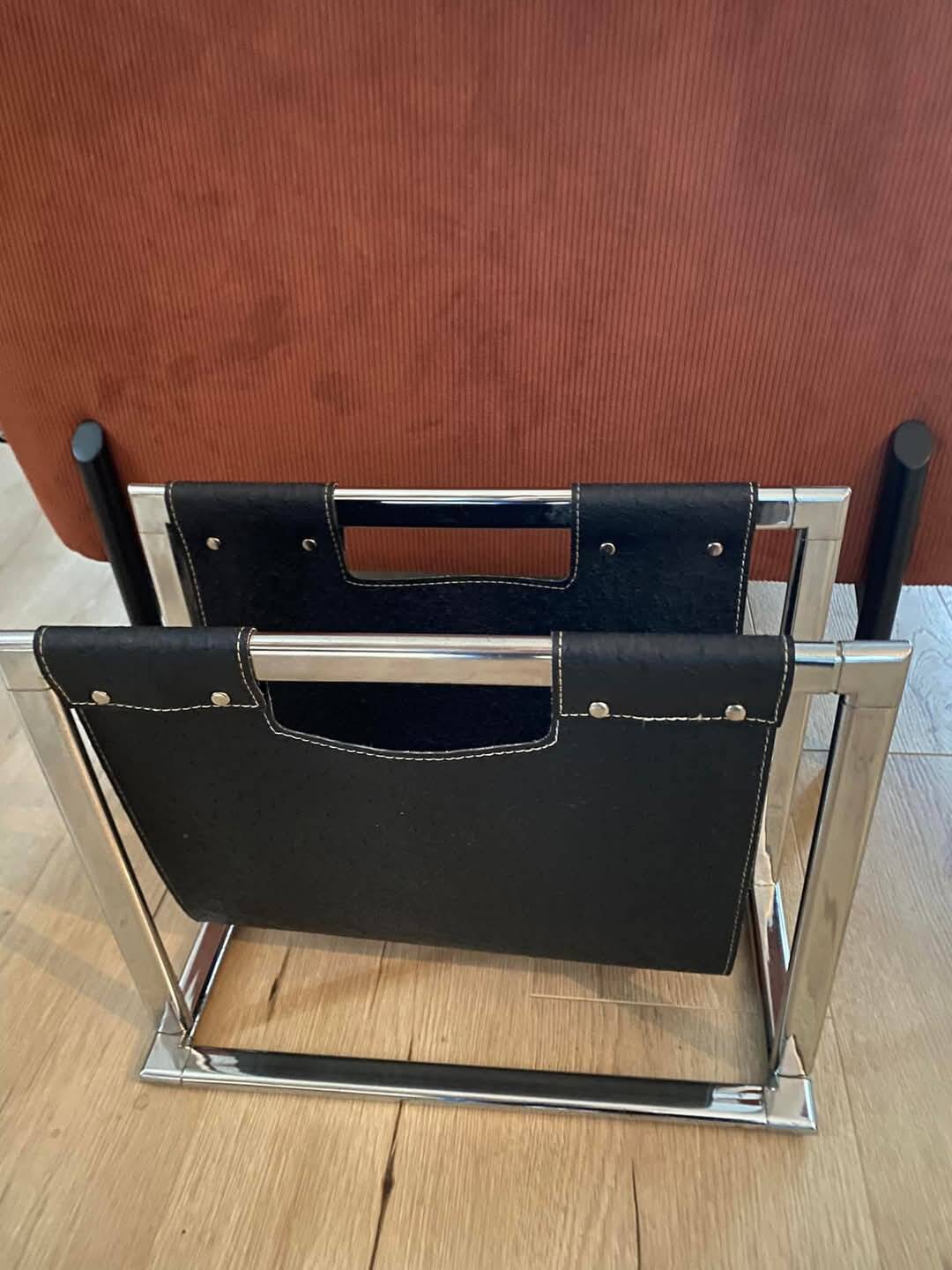 Chrome metal and leather magazine rack