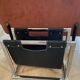 Chrome metal and leather magazine rack