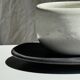 White Indonesian ceramic cup and gray saucer