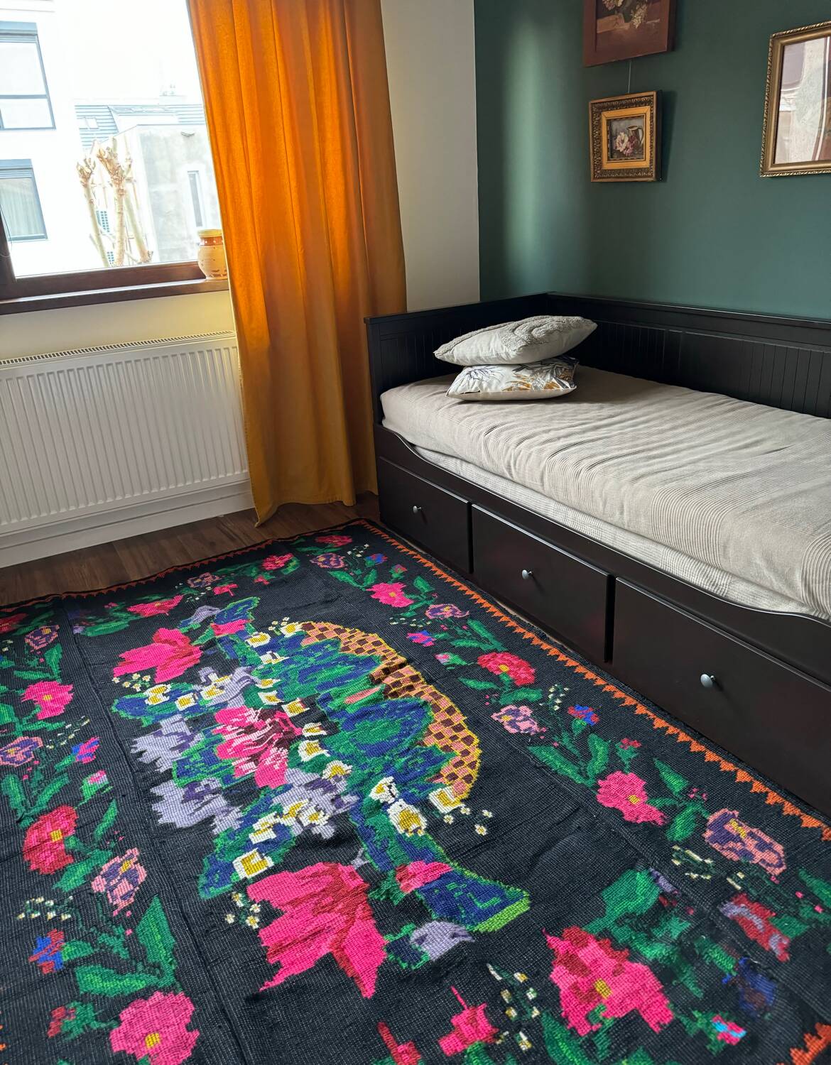 Romanian black wool carpet with a basket of colorful flowers