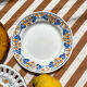 Set of twelve mismatched vintage dessert plates.