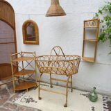 Rattan bassinet on folding support