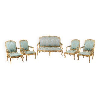 Louis XV style living room with gilded wooden frames. Circa 1880.