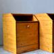 Pair of handcrafted solid wood bedside tables with drop-down doors.