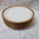 7 assiettes Limoges doré à l'or fin