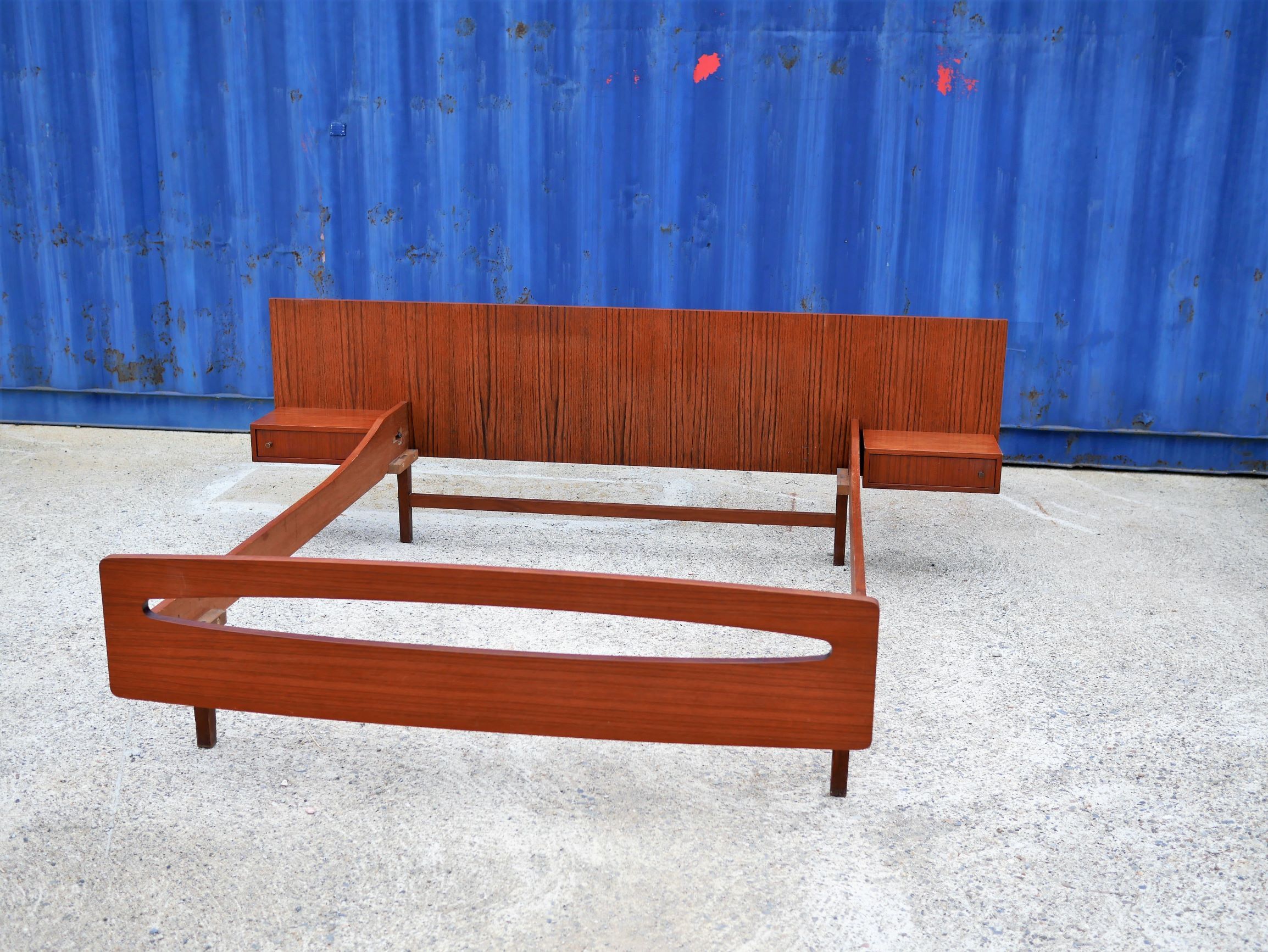 Teak bed with hanging bedside tables from the 60s