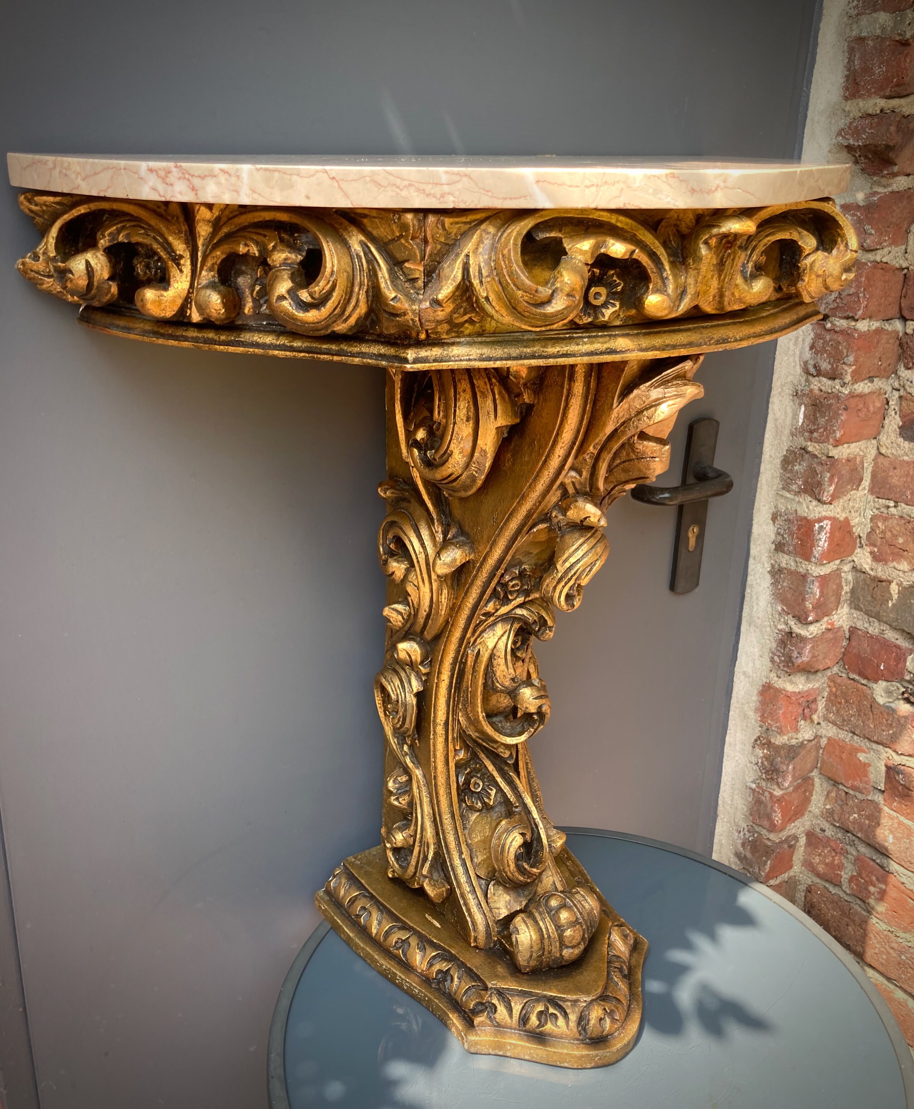 Carved wooden and marble console