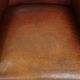 Neat, elegantly finished, cozy sheepskin club armchair with a fixed seat cushion