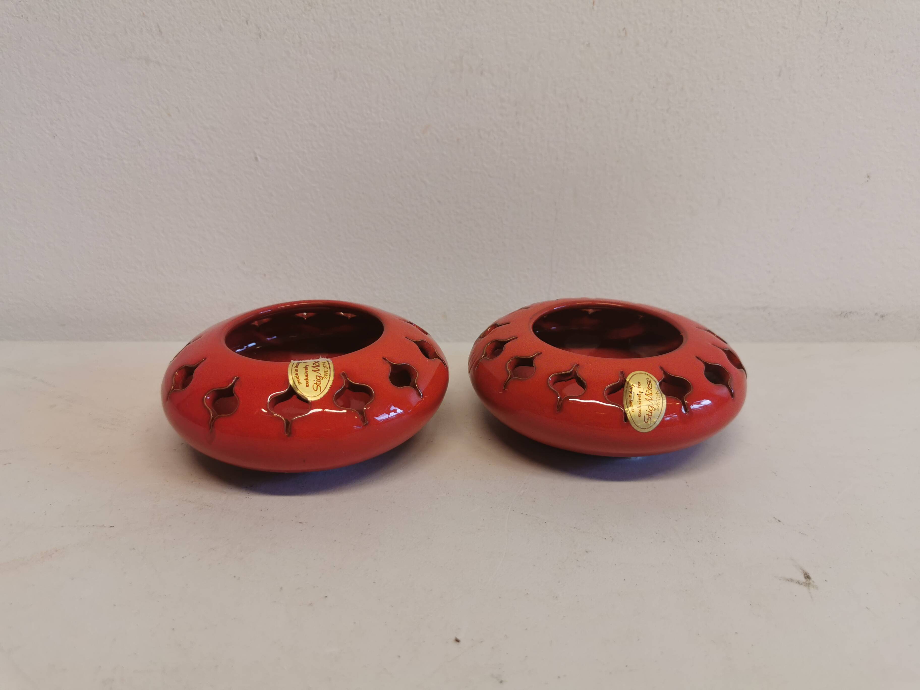 Pair of candle holders from the 1960s-1970s, crafted in red ceramic