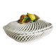 Covered basket in white woven ceramic and fruit slip.