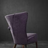 High-backed wing chair in oak and purple fabric, vintage Scandinavian style from the 1950s.