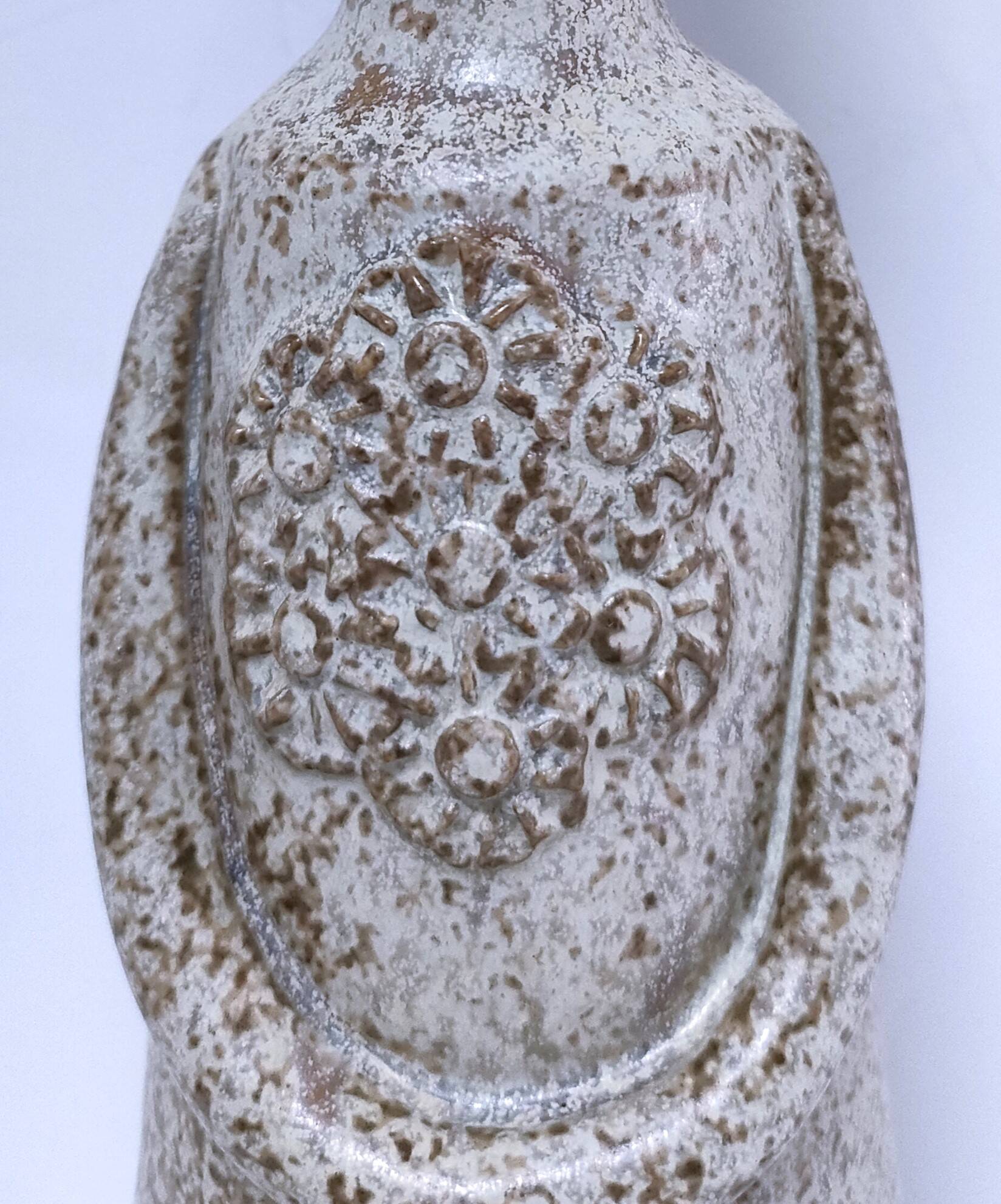 ceramic candle holder with crowned head signed P