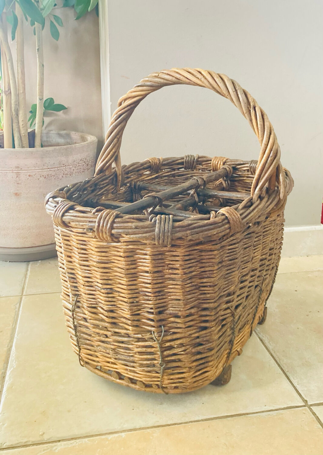 Wicker and hazel bottle basket from the early 20th century or possibly earlier.