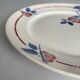 Round plate from the Céranord Saint-Amand service • Red and blue floral decoration