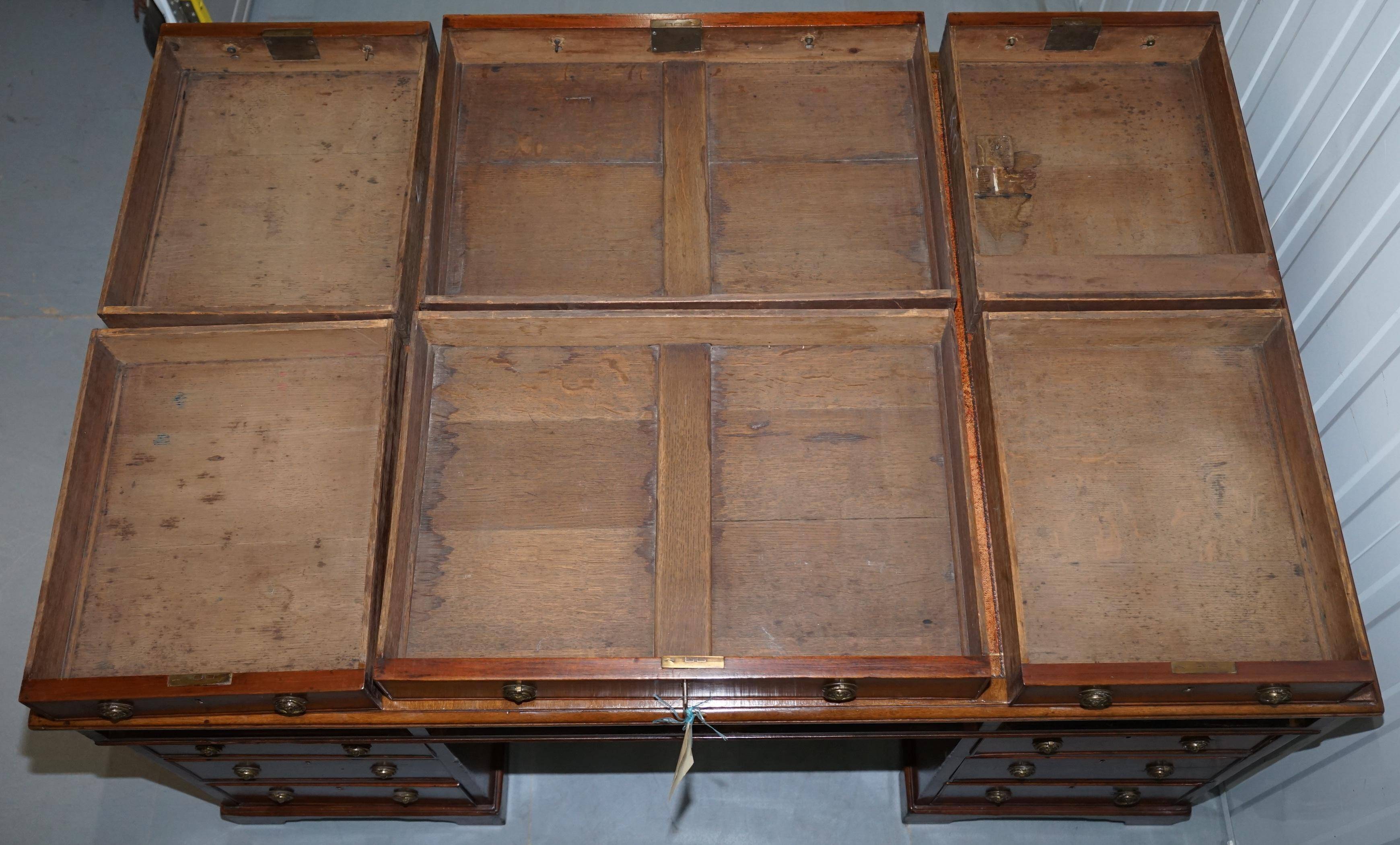 Double-sided partner's desk in walnut, George III, circa 1780, with lion head handles.