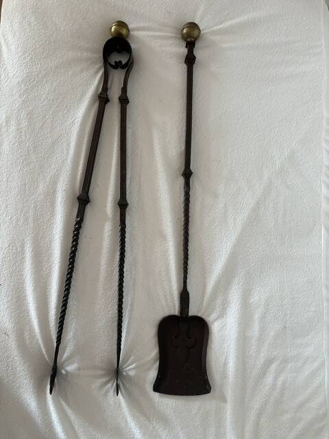 Large fireplace tongs and shovel from the 19th century.