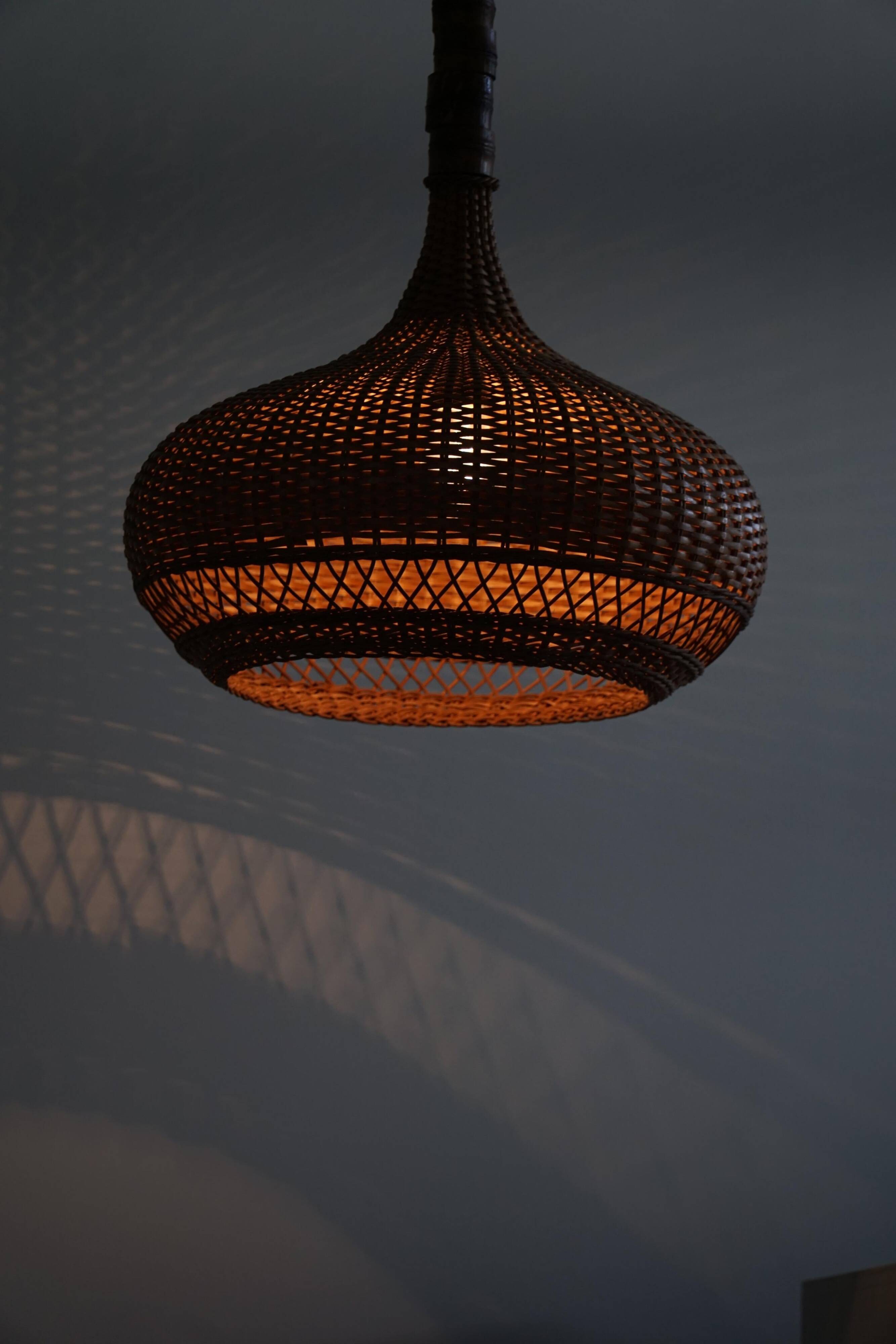 Vintage Danish mid-century rattan pendant light, made in the 1960s.