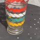 Transparent and gold glass vase and red, white, green and yellow silkscreen lines vintage 1960