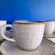 Speckled beige cup and saucer coffee set