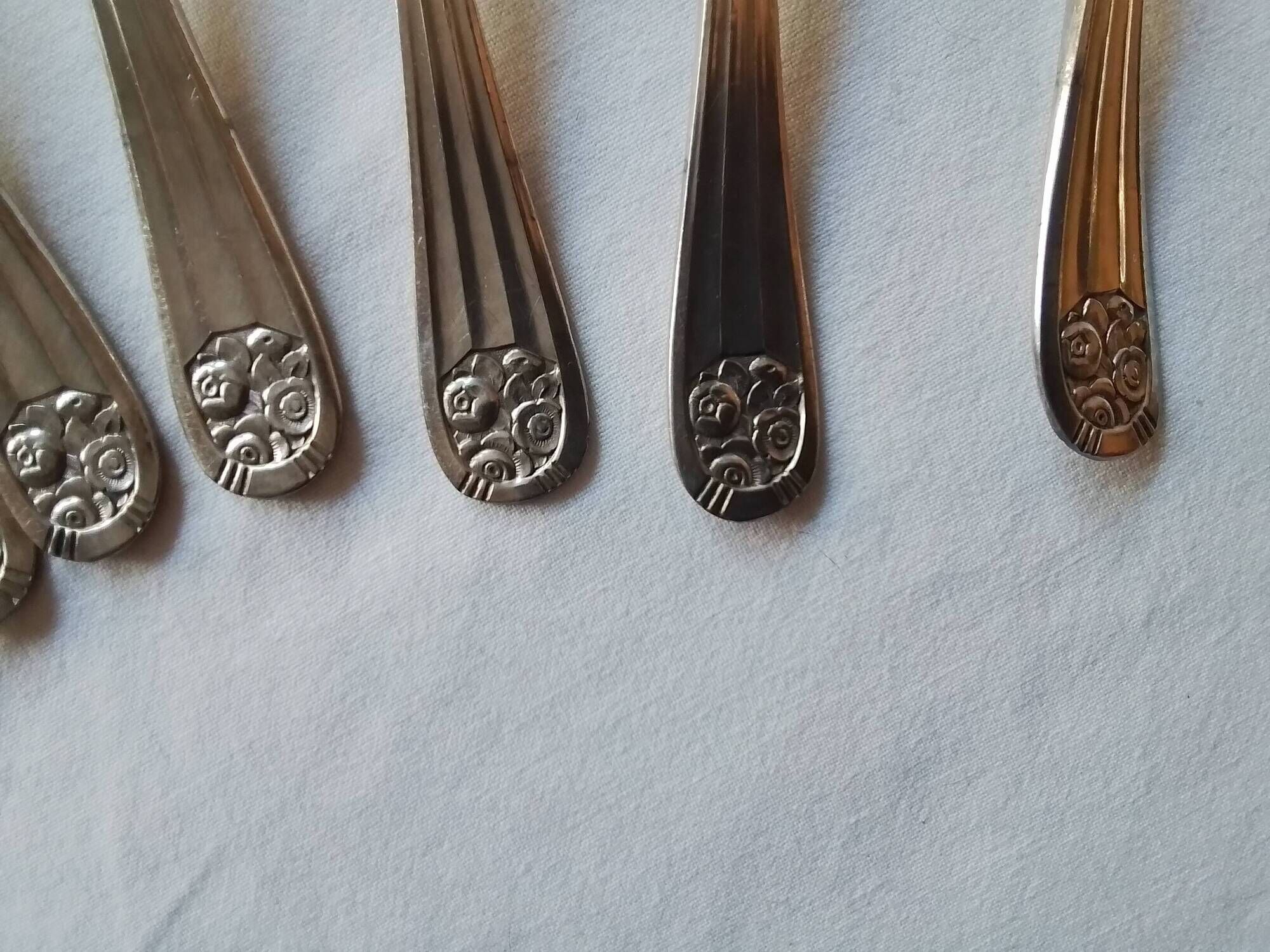12 Art Deco forks and 12 Bouillet Bourdelle soup spoons.