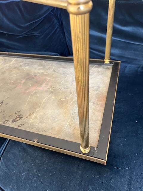 Black marble coffee table with brass legs.