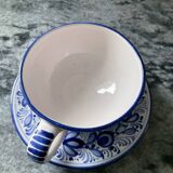 Set of 4 white/blue ceramic cups and saucers.
