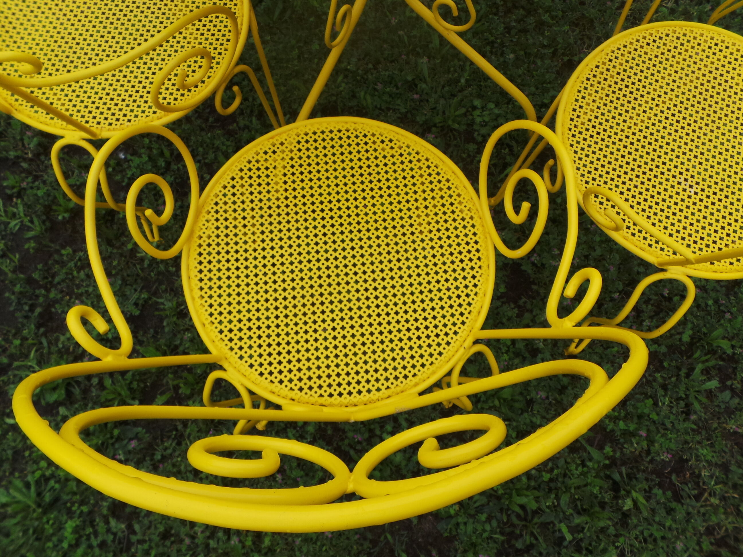 Yellow wrought iron garden room